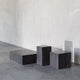 Audo Plinth Cubic Table in Nero Marquina Marble — studio, with Audo Plinth Low and Audo Plinth Tall