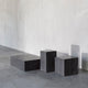 Audo Plinth Low Table in Nero Marquina Marble — studio, with Audo Plinth Tall and Audo Plinth Cubic