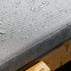 Skagerak Riviera Sunbed Cushion in Charcoal — lifestyle, detail