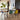  Vitra Eames Plastic Side Chair RE DSW — lifestyle, with Vitra Plate Dining Table, Nuage Vase and Aluminium Chair EA 108