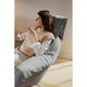 Vitra Bascule Highback Lounge Chair in Cento Light Sage and Light Lavender, Chalk base — lifestyle, detail, with model