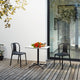 Vitra Belleville Chair Plastic in Deep Black — lifestyle, outdoor, with Vitra Belleville Bistro Table