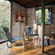 Vitra Cité Lounge Chair in Gris Vermeer — lifestyle, with Vitra Guéridon Bas, Rayonnage Mural