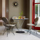 Vitra Noguchi Round Dining Table — lifestyle, with Eames Wire Chair DKR-2 Seat & Back Pad