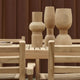Carl Hansen AH502 Outdoor Dining Chair with Armrests in teak — lifestyle, detail, with AH501 Outdoor Dining Chair, AH901 Outdoor Dining Table, AH902 Outdoor Dining Table Square
