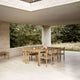 Carl Hansen AH502 Outdoor Dining Chair with Armrests in teak — lifestyle, with AH901 Outdoor Dining Table, AH912