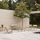 Carl Hansen AH911 Outdoor Side Table or Stool in teak — lifestyle, with AH601 Outdoor Lounge Chair, AH701 Outdoor Lounge Sofa, AH603 Outdoor Deck Chair