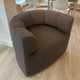 audo eave seamline swivel lounge chair in brown fabric in innes gallery in hessle on oak floor oak BM0121 carl hansen dining table and vitra eames dsr in background