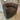 audo eave seamline swivel lounge chair in brown fabric in innes gallery in hessle on oak floor oak BM0121 carl hansen dining table and vitra eames dsr in background