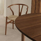Carl Hansen CH337 Extendable Dining Table in Mahogany Oil — lifestyle, with CH24 Wishbone Chair