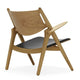 Carl Hansen CH28P Lounge Chair in Oak Oil, Black Leather — packshot, detail