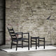 Carl Hansen CH53 Low Stool in Oak Black — lifestyle, with CH44 lounge chair