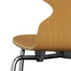A Fritz Hansen 3101 Ant Dining Chair with a wooden backrest and seat, four metal legs, in a wood finish. close up shot on white.