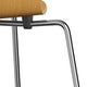 A Fritz Hansen 3101 Ant Dining Chair with a wooden backrest and seat, four metal legs, in a wood finish. close up shot on white.