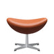 Fritz Hansen 3127 Egg Footstool in Grace Walnut leather with matt brushed base — packshot