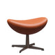 Fritz Hansen 3127 Egg Footstool in Grace Walnut leather with Warm Graphite base — packshot