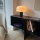 Flos Bellhop Glass T Table Light in Cioko — display, showroom illuminated