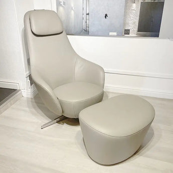 A B&B Italia Harbor Laidback swivel reclining armchair with an attached ottoman, displayed in a room setting. Ex-display chair with great discount on it. Innes