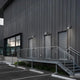 Louis Poulsen AJ 50 Wall Light Aluminium Coloured lifestyle building facade