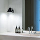 Louis Poulsen NJP Wall Lamp Short Arm in Black — lifestyle, bathroom