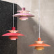 Louis Poulsen PH 5 300 Pendant Lights in Hues of Rose, Red and Orange — studio, group
