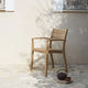 Skagerak Ballare Outdoor Dining Chair in Teak — lifestyle view 2