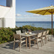 Skagerak Ballare Table and Chair with Messina Umbrella — lifestyle