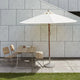 Skagerak Messina Parasol Off-White Ø210cm — lifestyle, with Capri Umbrella Foot 30Kg