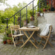 Skagerak Selandia Table 75×75cm and Selandia Outdoor Dining Chair — lifestyle