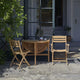 Skagerak Selandia Table D94cm and Selandia Outdoor Dining Chair and Armchair — lifestyle