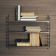 String Pocket Shelving in Walnut/Black — lifestyle
