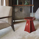 Vitra Tabouret Métallique in Japanese Red — lifestyle, with Vitra Fauteuil de Salon