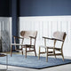 Carl Hansen CH22 Lounge Chair in Walnut and Oak/Walnut mix — lifestyle, with CH417 Tray Table